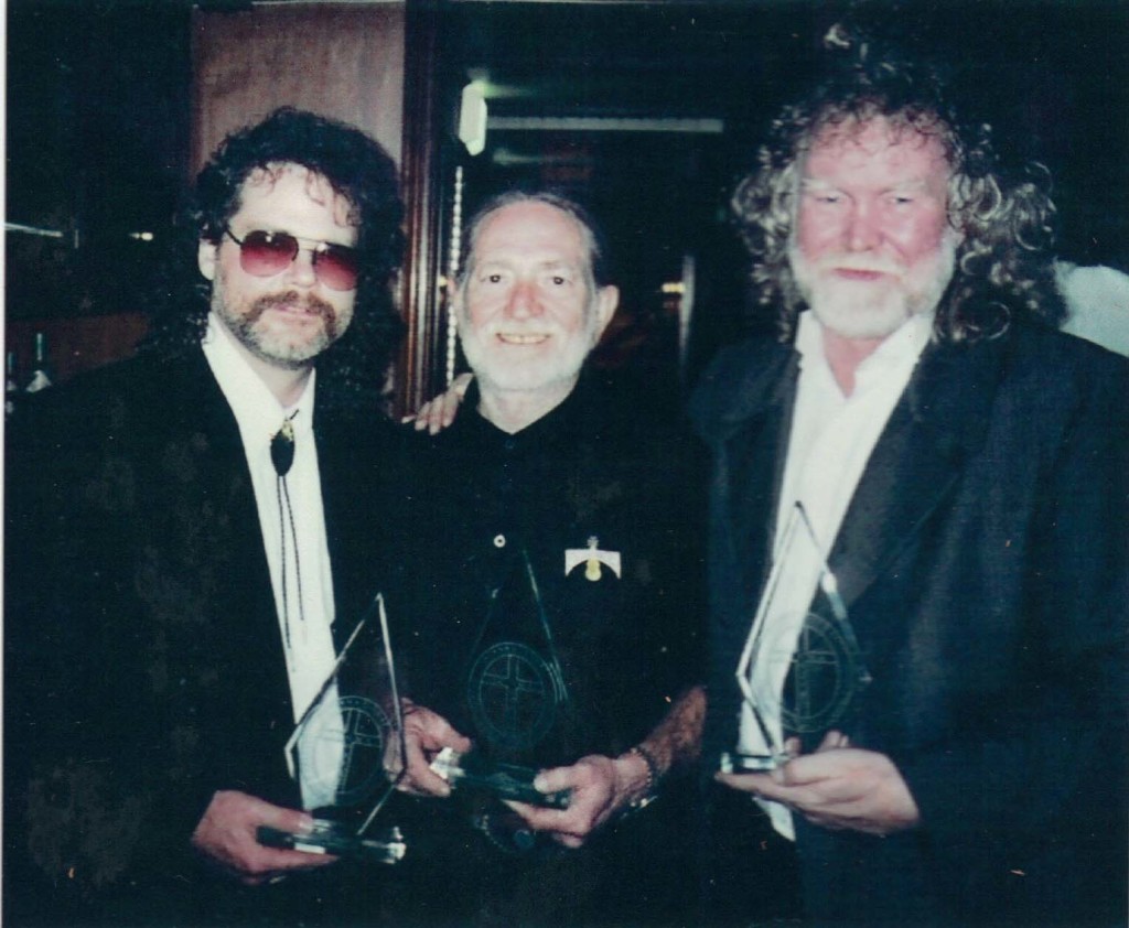 Robert MacDonald, Jr., Willie Nelson, Grant Boatwright with awards for Peace In The Valley